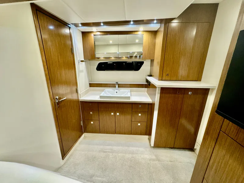 Slide: The Image of Interior of 2016 Cruisers Yachts 48 Cantius with wooden cabinetry. - 20