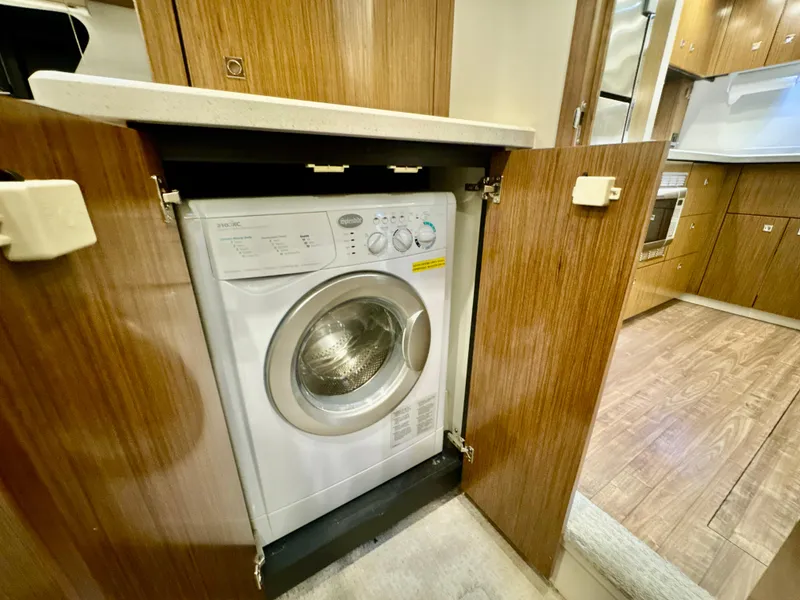 Slide: The Image of Washing machine in the kitchen of a 2016 Cruisers Yachts 48 Cantius. - 22