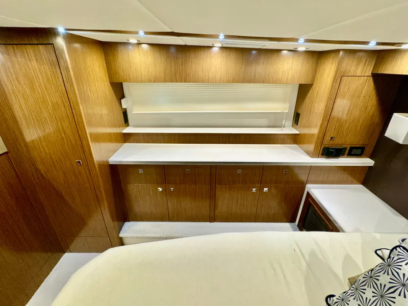 Slide: The Image of Interior of 2016 Cruisers Yachts 48 Cantius with wood paneling. - 26