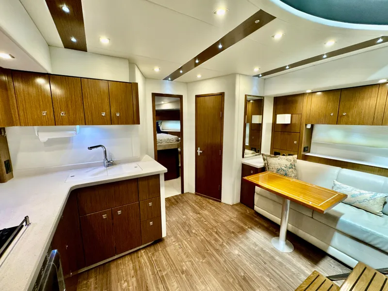 Slide: The Image of Interior of 2016 Cruisers Yachts 48 Cantius with modern kitchen and seating area. - 32