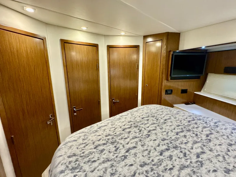 Slide: The Image of Interior of 2016 Cruisers Yachts 48 Cantius with wooden doors and TV. - 35
