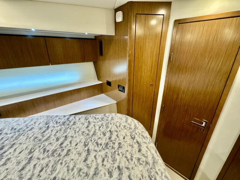 Slide: The Image of Interior of 2016 Cruisers Yachts 48 Cantius with wood doors and bed. - 39