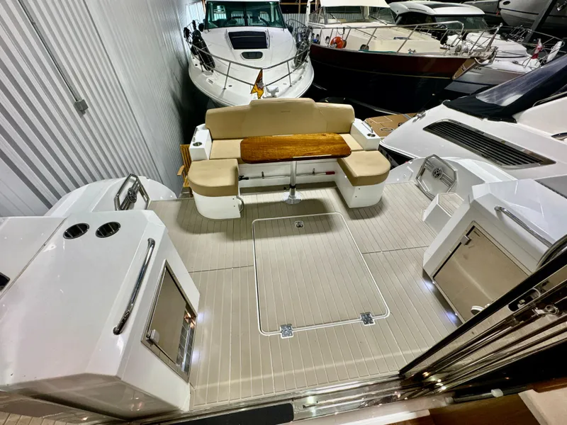 Slide: The Image of Interior view of a 2016 Cruisers Yachts 48 Cantius with seating area. - 45