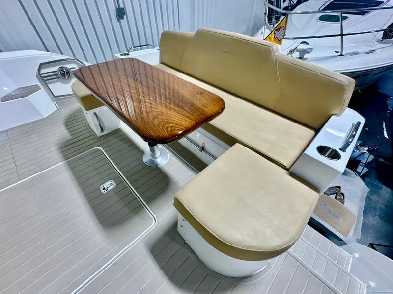 Slide: The Image of Interior of 2016 Cruisers Yachts 48 Cantius with seating and table. - 48