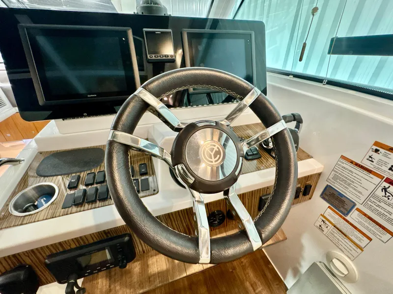 Slide: The Image of 2016 Cruisers Yachts 48 Cantius helm with modern instruments. - 7