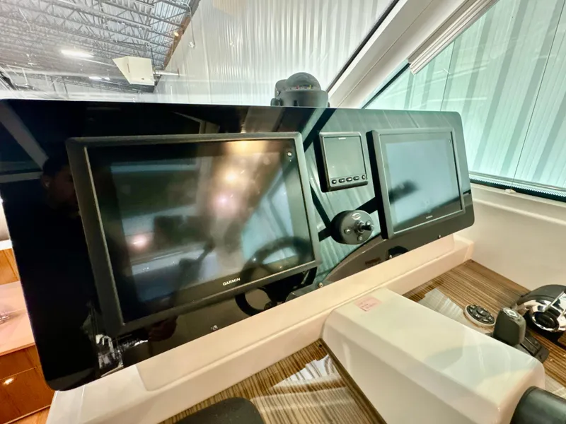 Slide: The Image of Dashboard of 2016 Cruisers Yachts 48 Cantius with modern displays. - 8