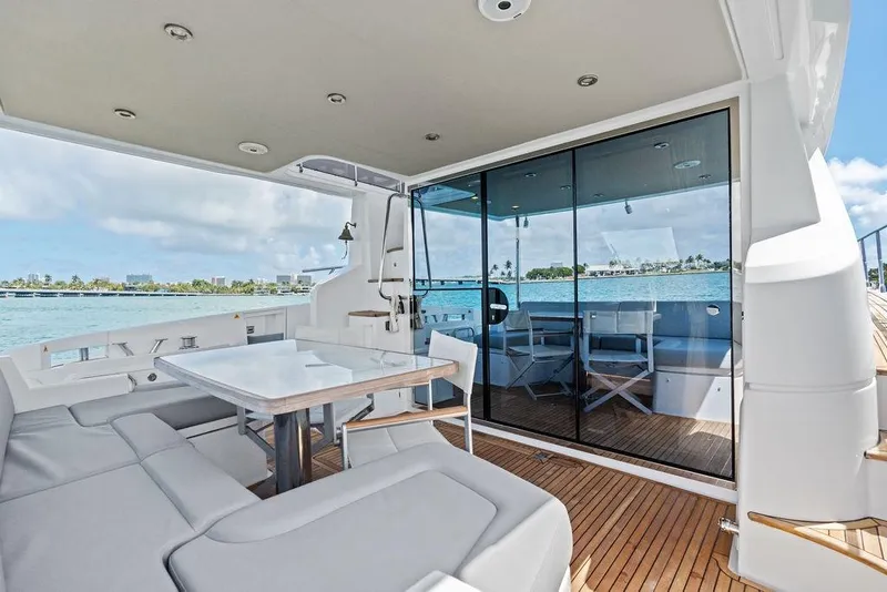 Slide: The Image of Luxurious 2019 Azimut yacht deck with seating, table, and ocean view. - 10