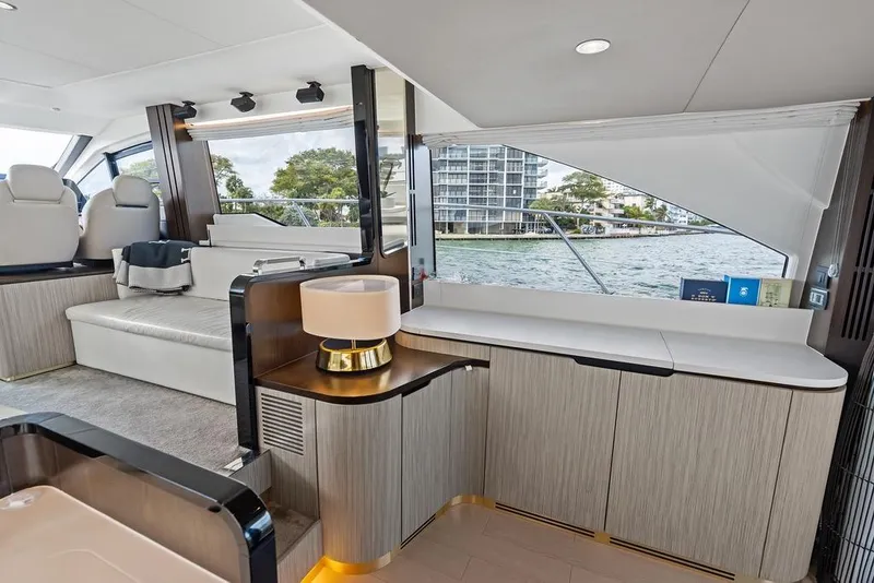 Slide: The Image of Luxurious interior of a 2019 Azimut yacht with modern furnishings and waterfront view. - 14