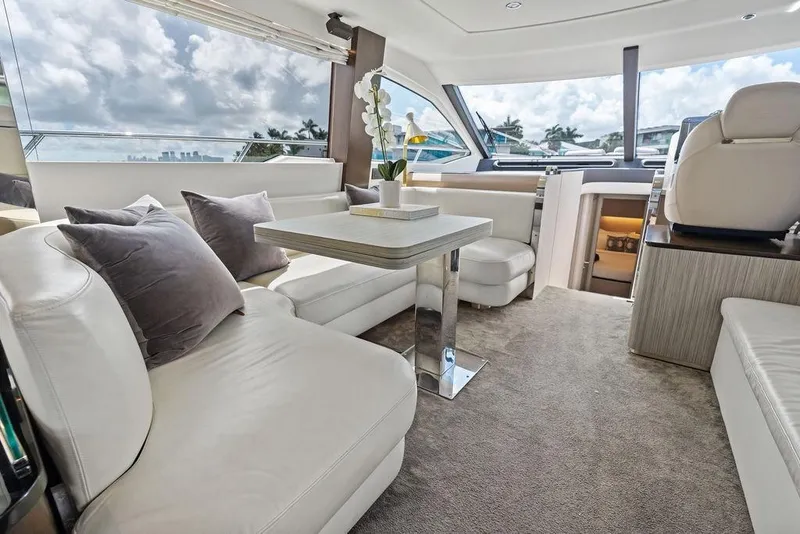 Slide: The Image of Luxurious 2019 Azimut yacht interior with plush seating, modern decor, and panoramic windows. - 19