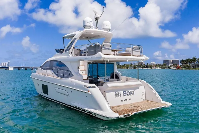 Slide: The Image of Luxurious 2019 Azimut yacht cruising in Miami waters under a clear blue sky. - 2