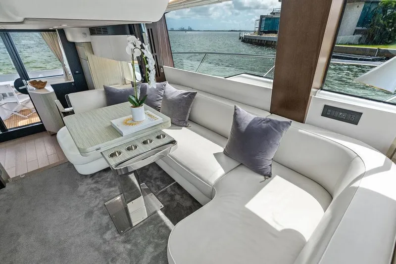 Slide: The Image of Luxurious 2019 Azimut yacht interior with elegant seating and scenic ocean view. - 23