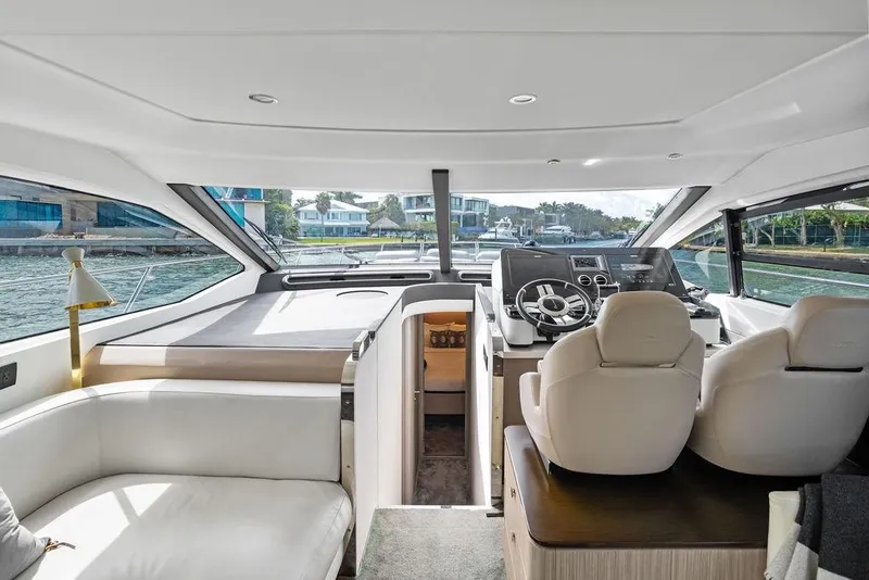 Slide: The Image of Interior of a 2019 Azimut yacht with modern helm and luxurious seating. - 24