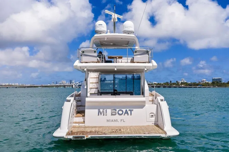 Slide: The Image of Azimut yacht from 2019 on Miami waters, clear skies, city skyline in background. - 3