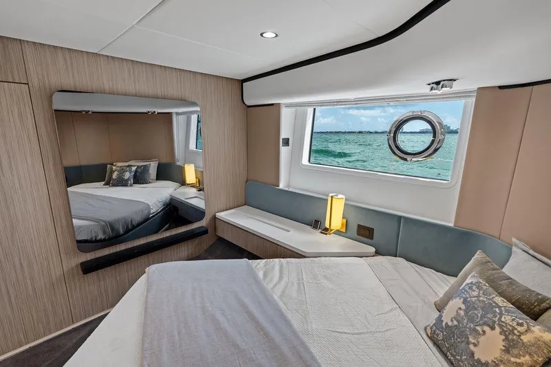 Slide: The Image of Luxurious Azimut yacht bedroom interior with ocean view, modern decor, and elegant furnishings, 2019 model. - 30