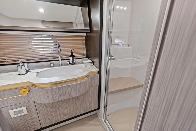 Slide: The Image of Luxurious Azimut yacht bathroom with modern sink, mirror, and shower, 2019 model. - 33