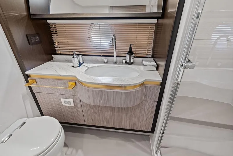 Slide: The Image of Luxurious Azimut yacht bathroom with modern sink, marble countertop, and elegant fixtures, 2019 model. - 34