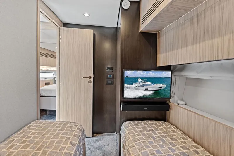 Slide: The Image of Interior of 2019 Azimut yacht cabin with twin beds and wall-mounted TV. - 39
