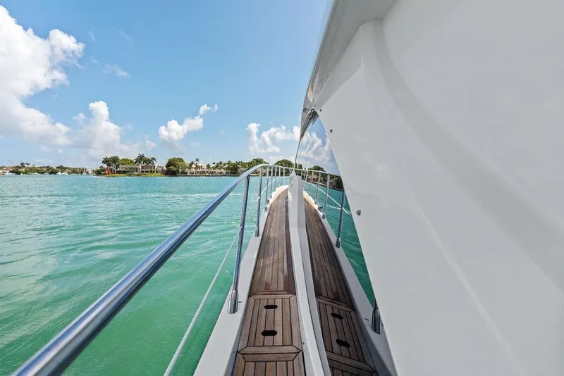 Slide: The Image of Side view of a 2019 Azimut yacht on turquoise water under a clear sky. - 41