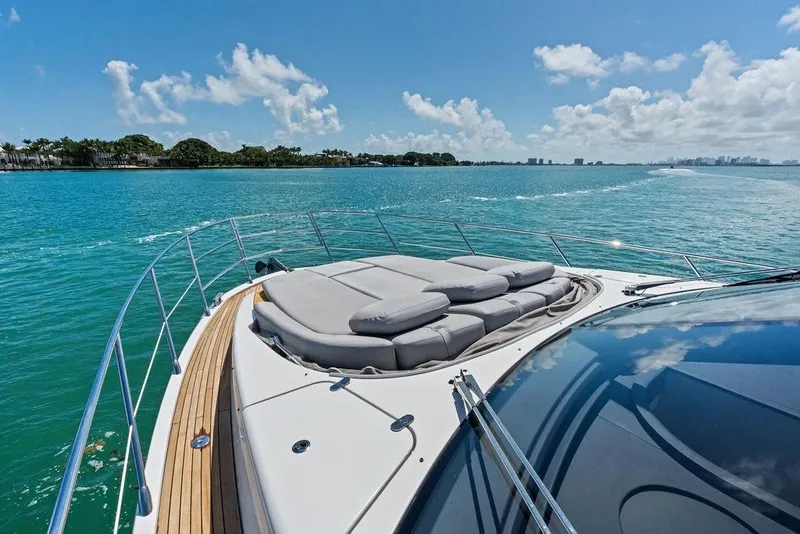 Slide: The Image of Luxurious 2019 Azimut yacht cruising on clear blue waters under a sunny sky. - 43
