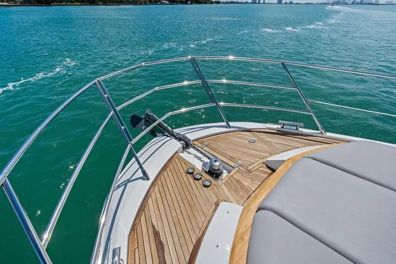 Slide: The Image of Bow of a 2019 Azimut yacht with teak decking on calm blue waters. - 44