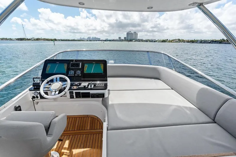 Slide: The Image of Luxurious 2019 Azimut yacht helm with modern navigation systems and spacious seating. - 45