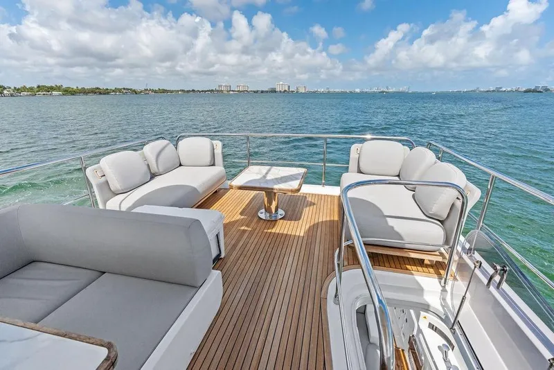 Slide: The Image of Luxurious 2019 Azimut yacht deck with plush seating and ocean view. - 49