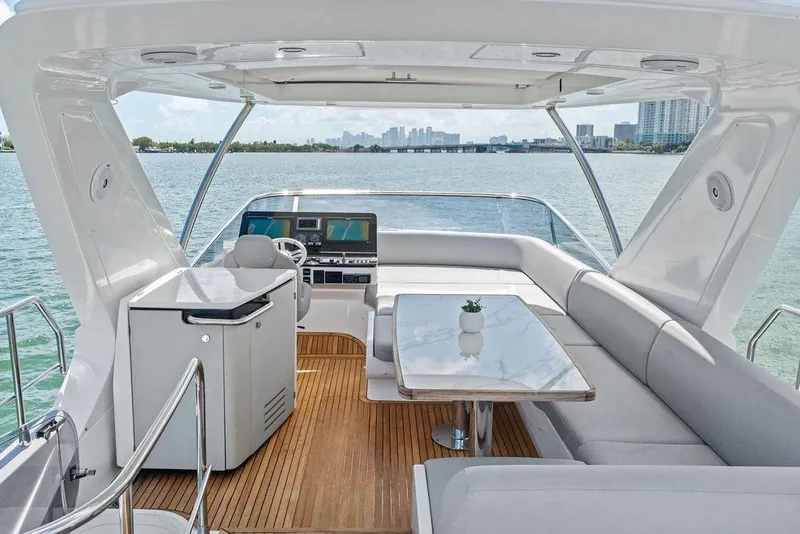 Slide: The Image of Luxurious 2019 Azimut yacht interior with elegant seating and scenic water views. - 51