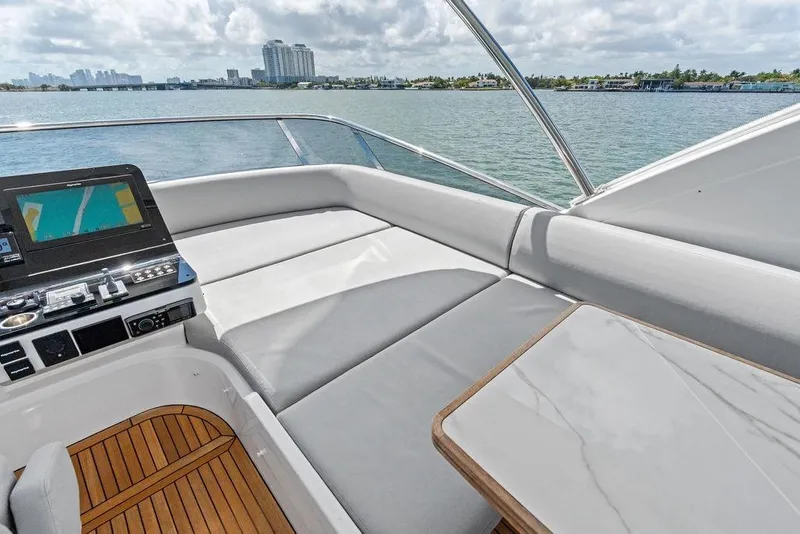 Slide: The Image of Luxurious 2019 Azimut yacht deck with navigation system and scenic waterfront view. - 52