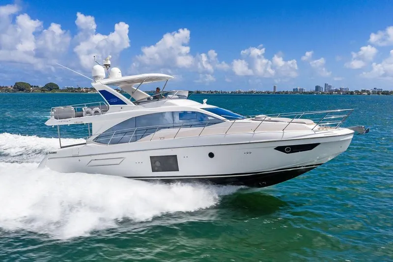 Slide: The Image of Luxury 2019 Azimut yacht cruising on clear blue waters under a sunny sky. - 8