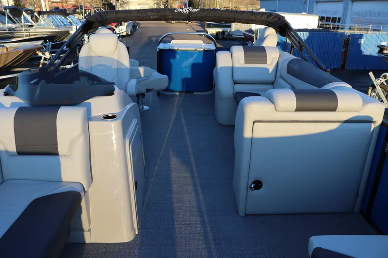 Slide: The Image of 2026 SunChaser Geneva Fish 22 pontoon boat interior with plush seating and modern design. - 15