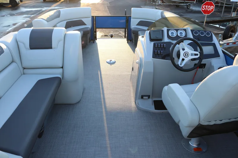 Slide: The Image of 2026 SunChaser Geneva Fish 22 pontoon boat interior with plush seating and modern dashboard. - 9