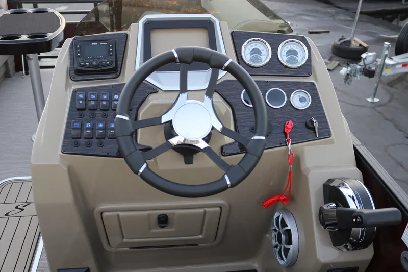 Slide: The Image of Steering console of 2026 SunChaser Eclipse 23 SB DH boat with modern controls and gauges. - 12