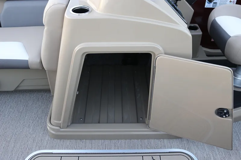Slide: The Image of Open storage compartment on 2026 SunChaser Eclipse 23 SB DH boat, featuring beige interior. - 16