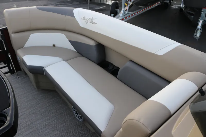 Slide: The Image of 2026 SunChaser Eclipse 23 SB DH boat interior with beige and gray seating. - 17