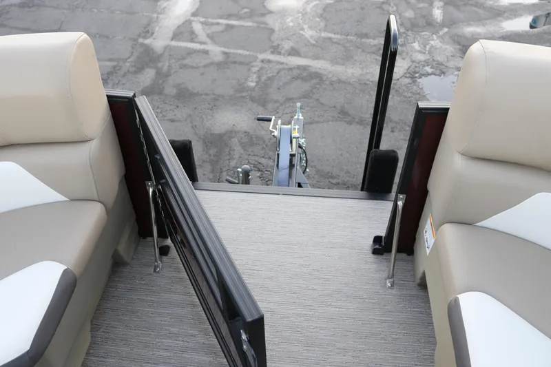 Slide: The Image of 2026 SunChaser Eclipse 23 SB DH boat interior with beige seating and open gate. - 20