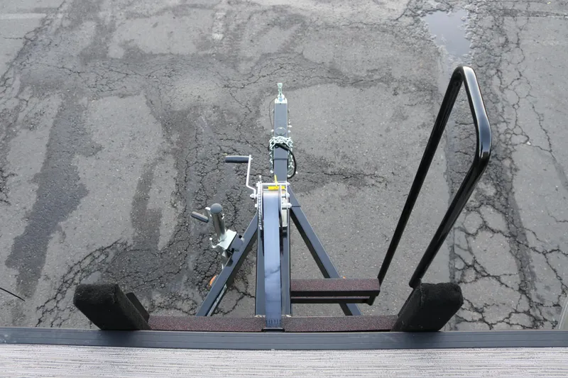 Slide: The Image of Trailer hitch of 2026 SunChaser Eclipse 23 SB DH on cracked asphalt surface. - 21