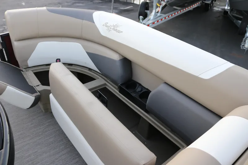 Slide: The Image of Interior seating of 2026 SunChaser Eclipse 23 SB DH pontoon boat, featuring beige and gray upholstery. - 22