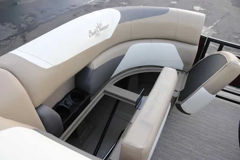 Slide: The Image of 2026 SunChaser Eclipse 23 SB DH boat interior with beige seating and storage compartments. - 23