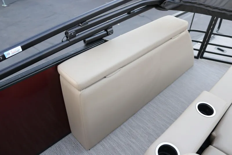 Slide: The Image of 2026 SunChaser Eclipse 23 SB DH boat interior with beige seating and cup holders. - 32