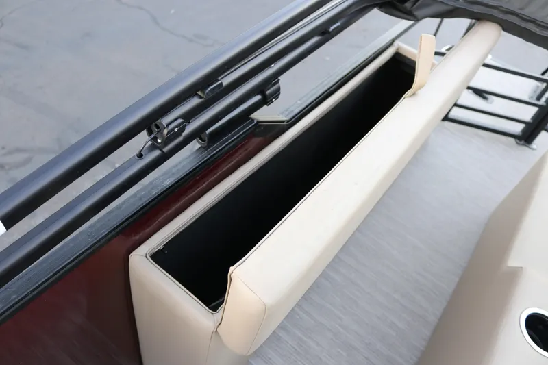 Slide: The Image of Storage compartment on 2026 SunChaser Eclipse 23 SB DH boat, featuring beige upholstery. - 33