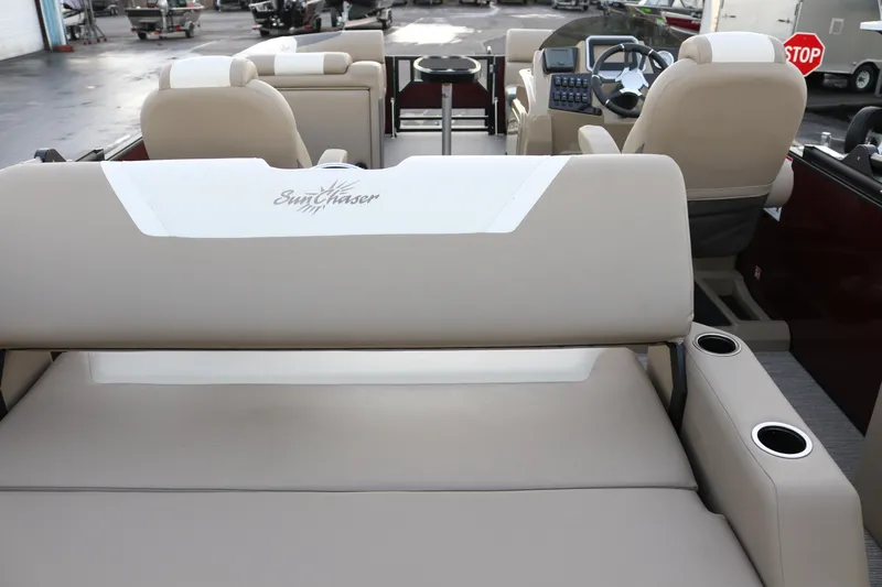 Slide: The Image of 2026 SunChaser Eclipse 23 SB DH pontoon boat interior with beige seating and console. - 35