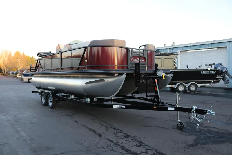 Slide: The Image of 2026 SunChaser Eclipse 23 SB DH pontoon boat on trailer, parked outdoors. - 4
