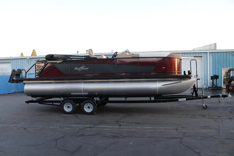 Slide: The Image of 2026 SunChaser Eclipse 23 SB DH pontoon boat on trailer, parked outdoors. - 5