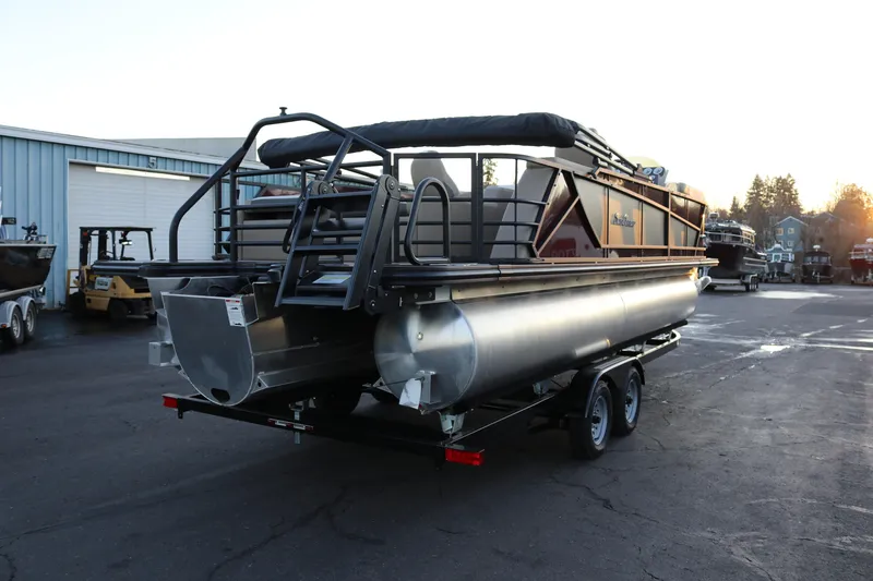 Slide: The Image of 2026 SunChaser Eclipse 23 SB DH pontoon boat on trailer at marina. - 6