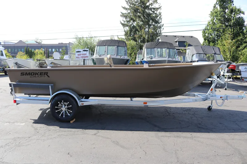 The Image of 2026 Smoker Craft Freedom 180 TL boat on trailer in outdoor showroom. - 0