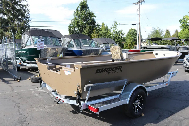Slide: The Image of 2026 Smoker Craft Freedom 180 TL boat on trailer in outdoor showroom. - 11