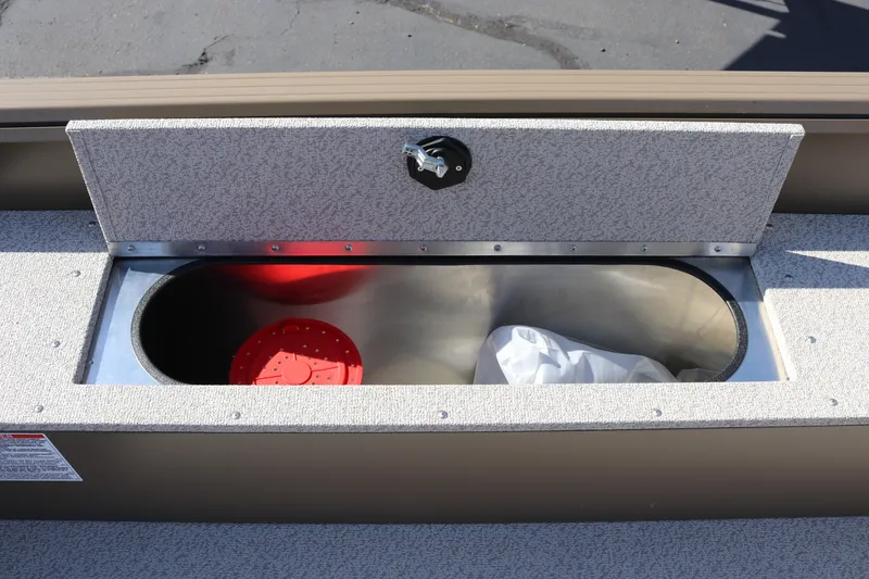 Slide: The Image of Storage compartment on 2026 Smoker Craft Freedom 180 TL boat, featuring a secure latch. - 7
