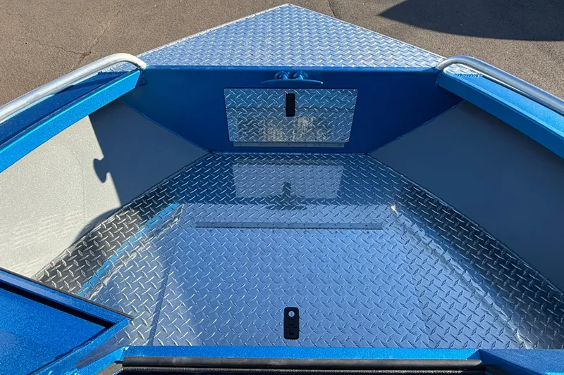 Slide: The Image of Interior of 2026 Alumaweld Intruder Outboard 22 boat with steering wheel and seating. - 12