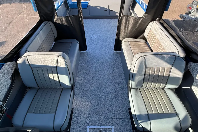 Slide: The Image of 2026 Alumaweld Intruder Outboard 22 boat seat, gray upholstery, interior view. - 16