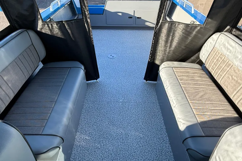 Slide: The Image of Interior seating of 2026 Alumaweld Intruder Outboard 22 boat, featuring gray cushioned bench. - 17